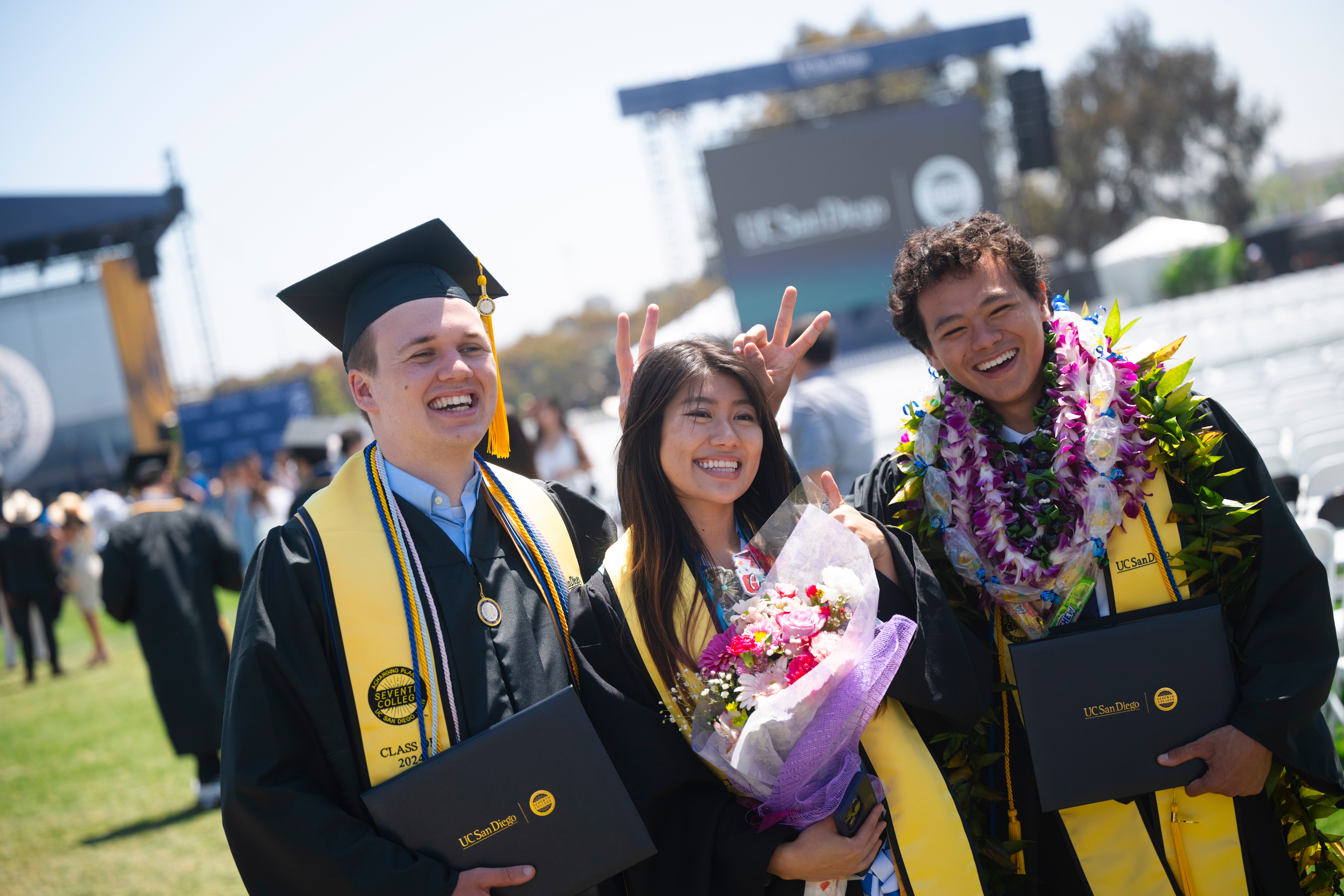 3 of 3, 3 graduates smiling