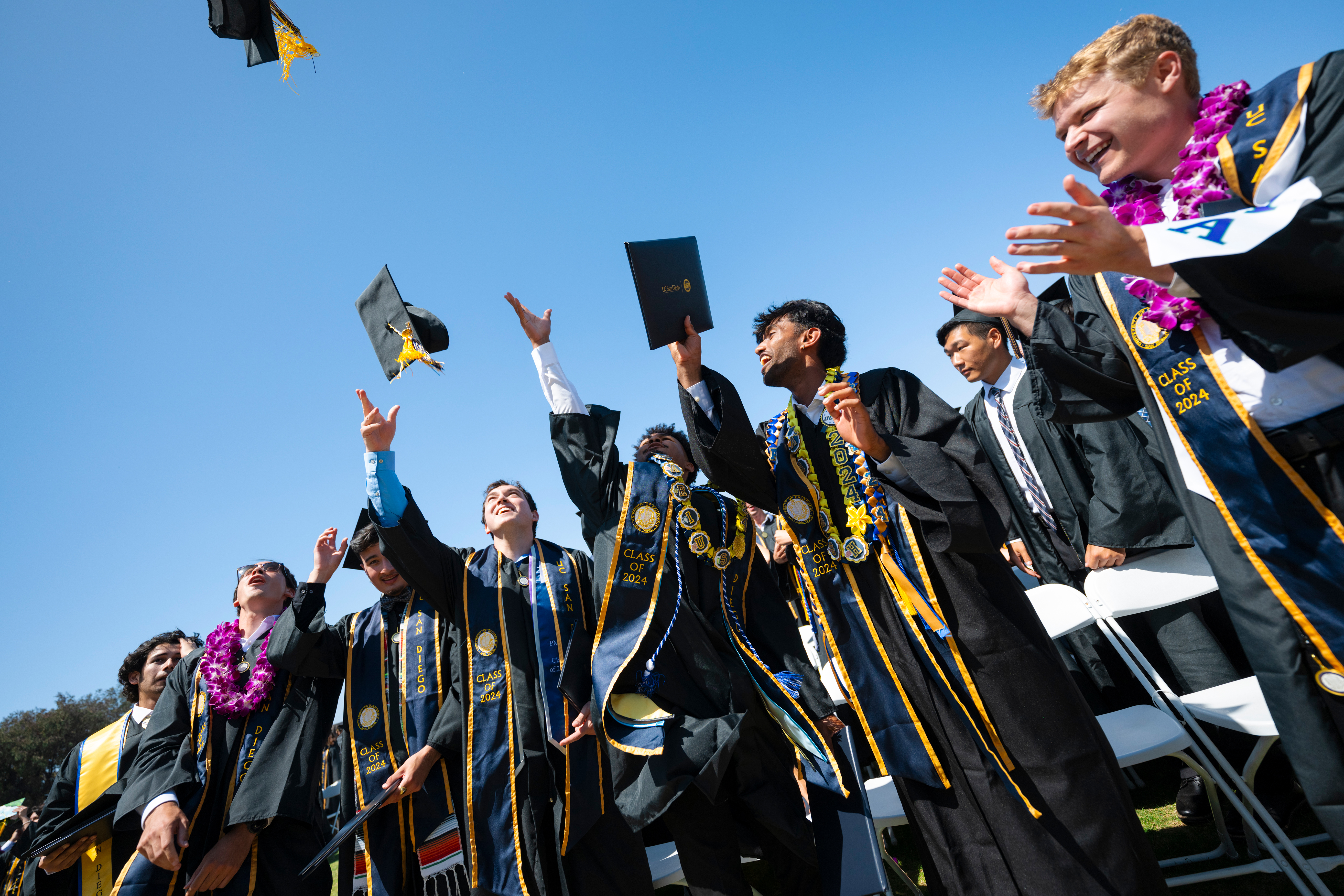 2 of 3, graduates cheering